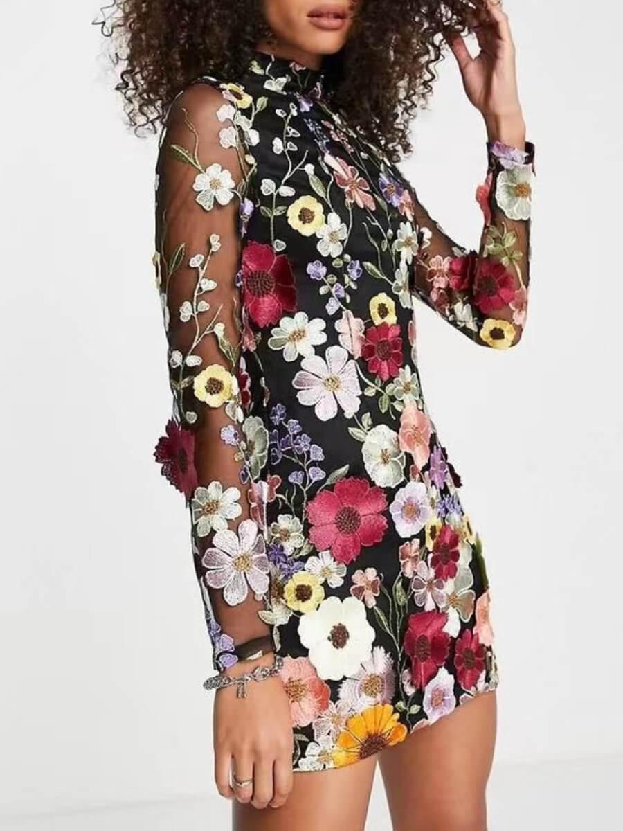 Close-up of the elegant 3D floral embroidery on a women's black party dress, highlighting chic design.