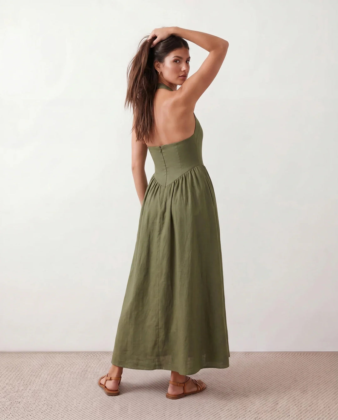 Women's elegant A-line maxi dress, halter neck with corset detail, creating a sculpted, sophisticated look.