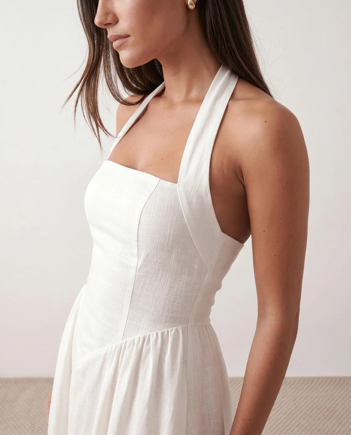 Long women's party dress. Halter neckline, A-line cut, and beautiful corset detail for a special occasion.