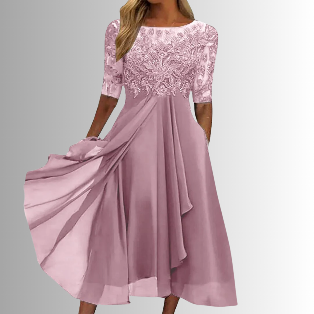 Close-up of the delicate lace & intricate embroidery detailing on this elegant women's A-line midi dress.