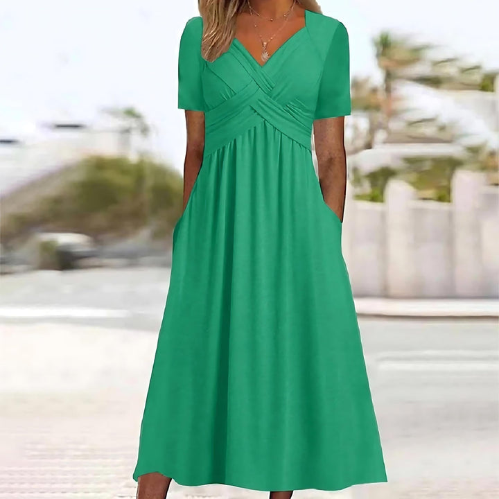Elegant women's A-line midi dress, graceful flowy design, perfect for chic occasion wear or summer events.