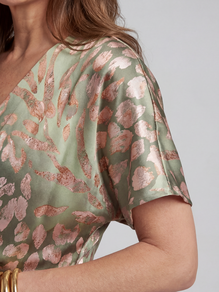 Lightweight short sleeve women's midi dress with an elegant abstract print & comfortable twist waist for summer.
