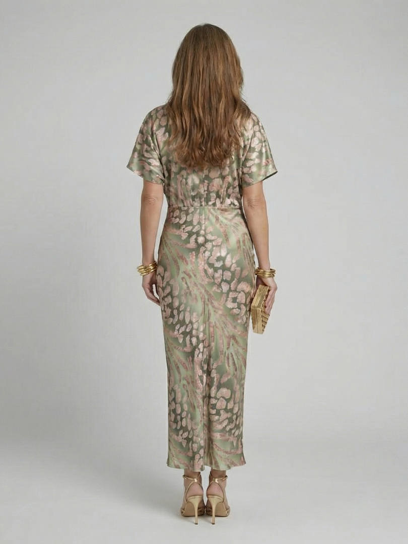 Women's elegant abstract print midi dress featuring a flattering twist waist detail & v-neckline for a chic look.