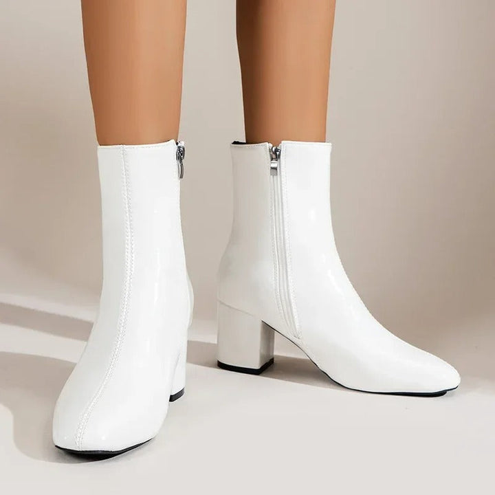 Elegant women's ankle boots with block heel & pointed toe. Versatile for chic everyday wear.