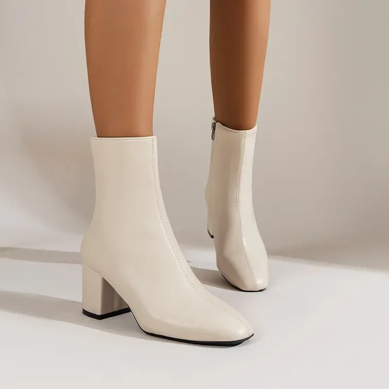 Stylish women's ankle boots. Versatile footwear with elegant pointed toe & comfortable block heel.