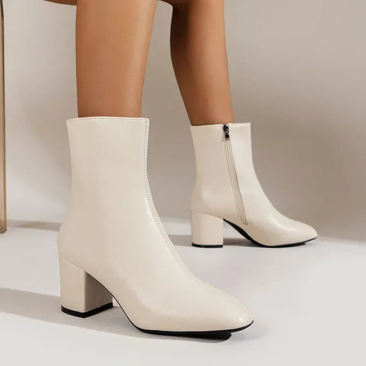 Beige women's versatile ankle boots. Elegant design with comfortable block heel & pointed toe.