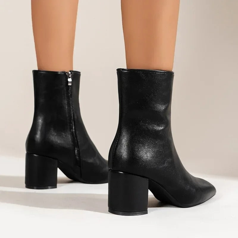 Fashionable women's ankle boots. Elegant pointed toe and block heel provide chic, versatile style.