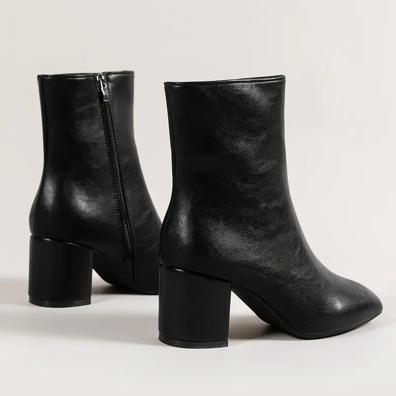 Elegant and versatile women's ankle boots with a chic pointed toe and comfortable block heel design.