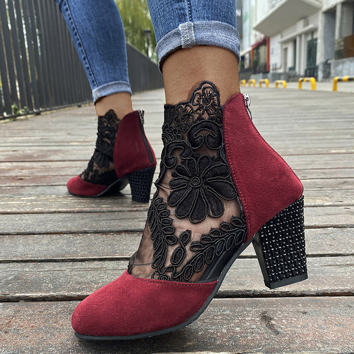 Stylish ladies' fashion boots: black lace embroidered ankle boots with comfortable block heels. Dressy footwear.