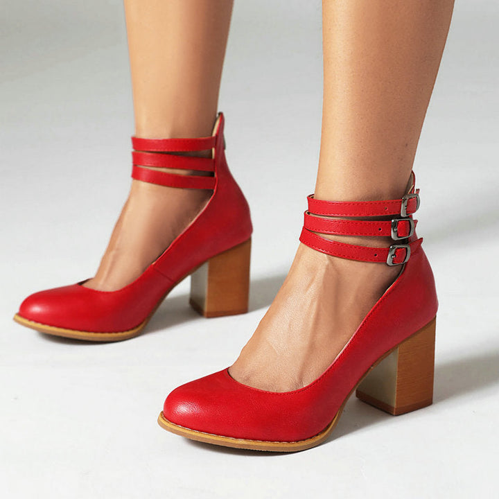 Stylish red ankle strap block heels for women, comfortable closed toe perfect for fashion outfits.