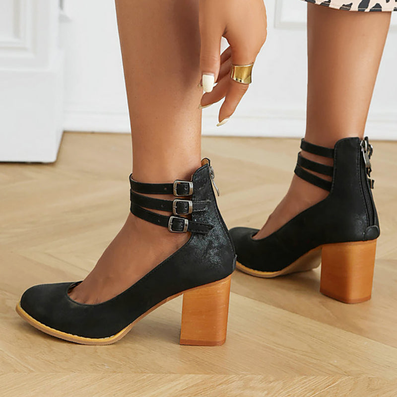 Elegant dress shoes: white ankle strap block heels with a comfortable closed toe, ideal for events.