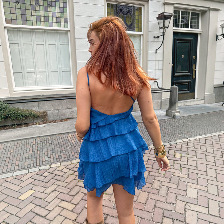 Chic women's lightweight mini dress, asymmetric ruffle style, perfect for vacations.