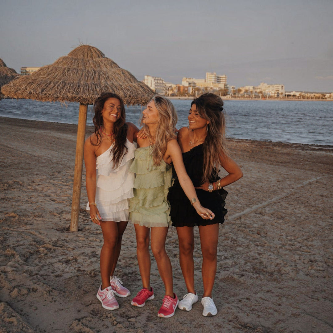 Chic women's lightweight mini dress with asymmetric ruffle, ideal for summer vacation outfits.