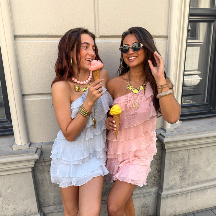 Chic women's vacation dress, lightweight asymmetric mini, perfect for summer fashion.