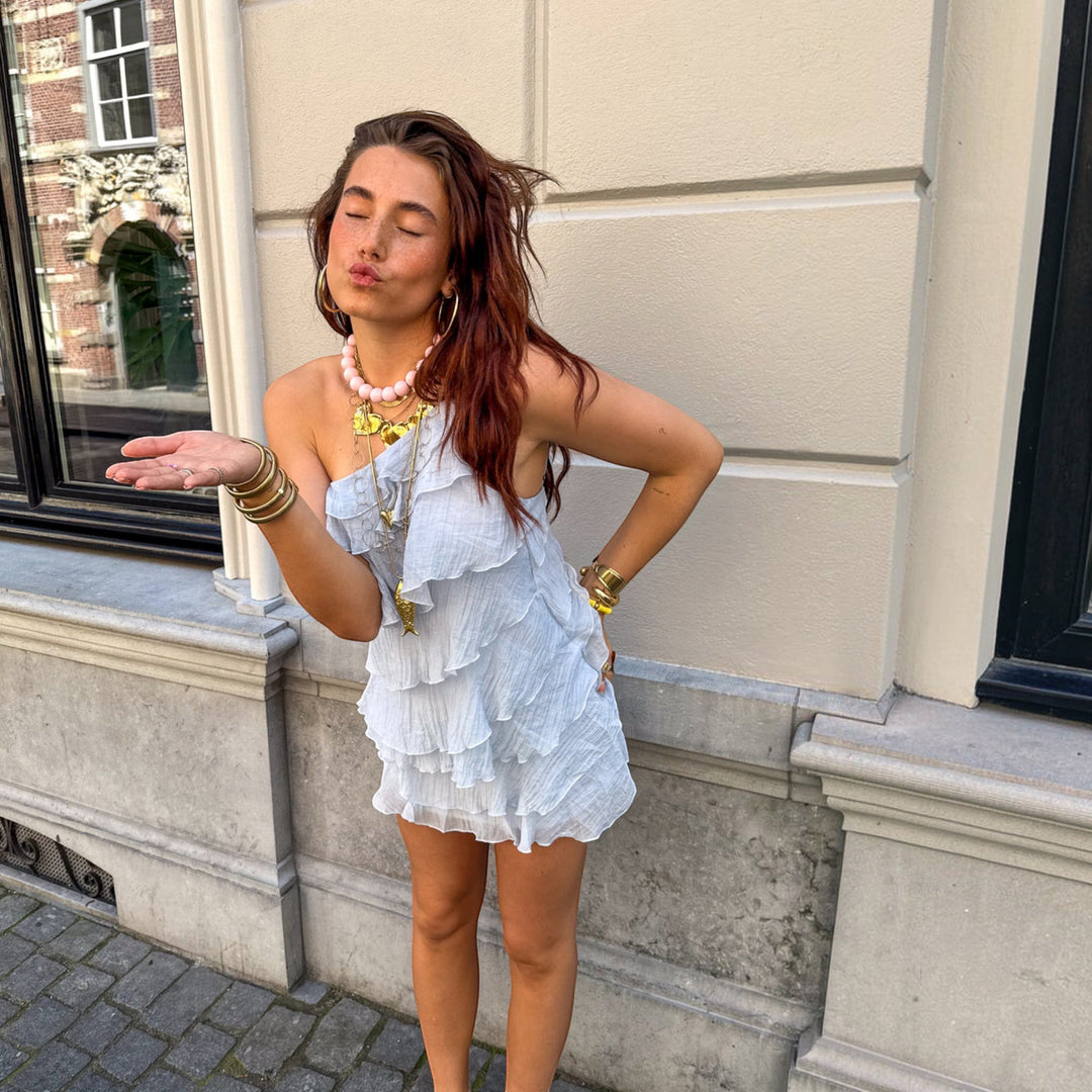Lightweight asymmetric mini dress for women, chic and perfect as a summer casual or party dress.