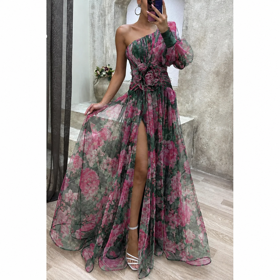 Flowing women's maxi dress with vibrant floral print & elegant asymmetrical hemline, ideal for parties.
