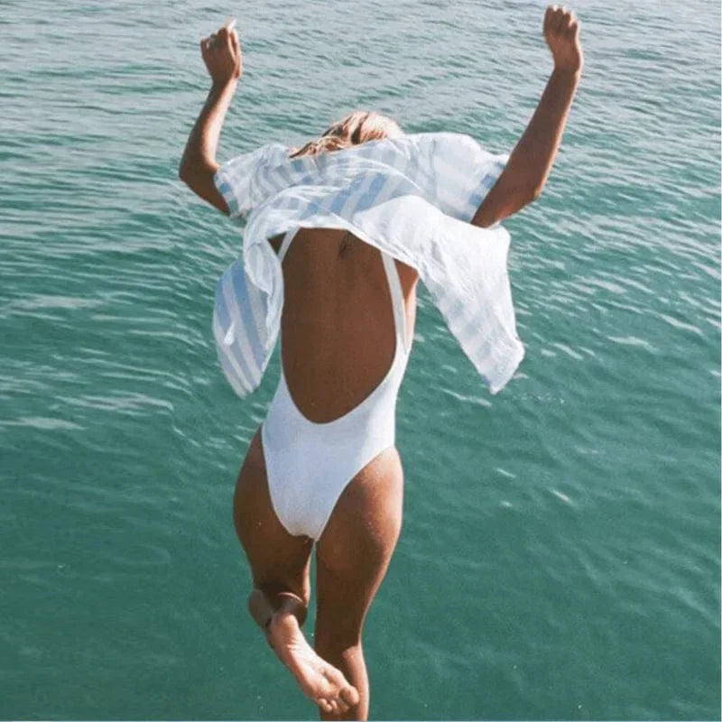 Stylish round neck backless one-piece swimsuit. Ideal women's beachwear for vacation style.