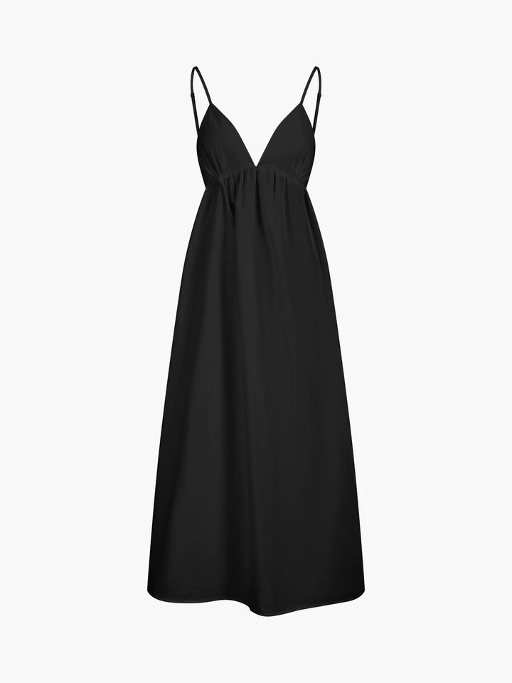 Flattering women's V-neck A-line midi dress, sleeveless and backless, featuring delicate spaghetti straps.