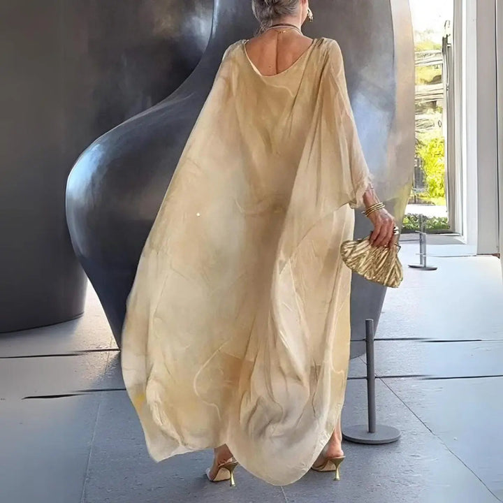 Versatile women's long sleeve maxi dress; elegant batwing gown suitable for day or evening wear.