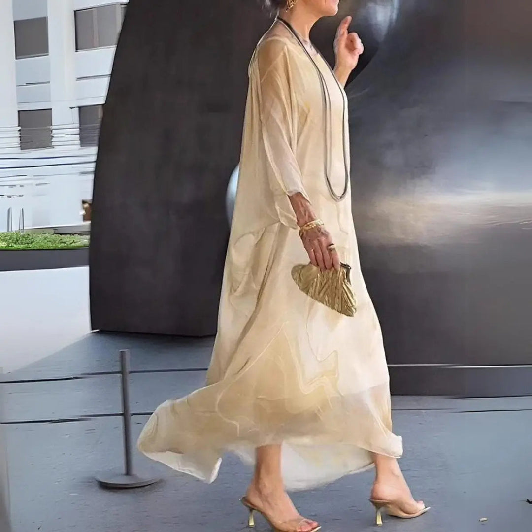 Beautiful women's floaty maxi dress, ideal as a wedding guest dress or elegant evening gown. Batwing sleeves.