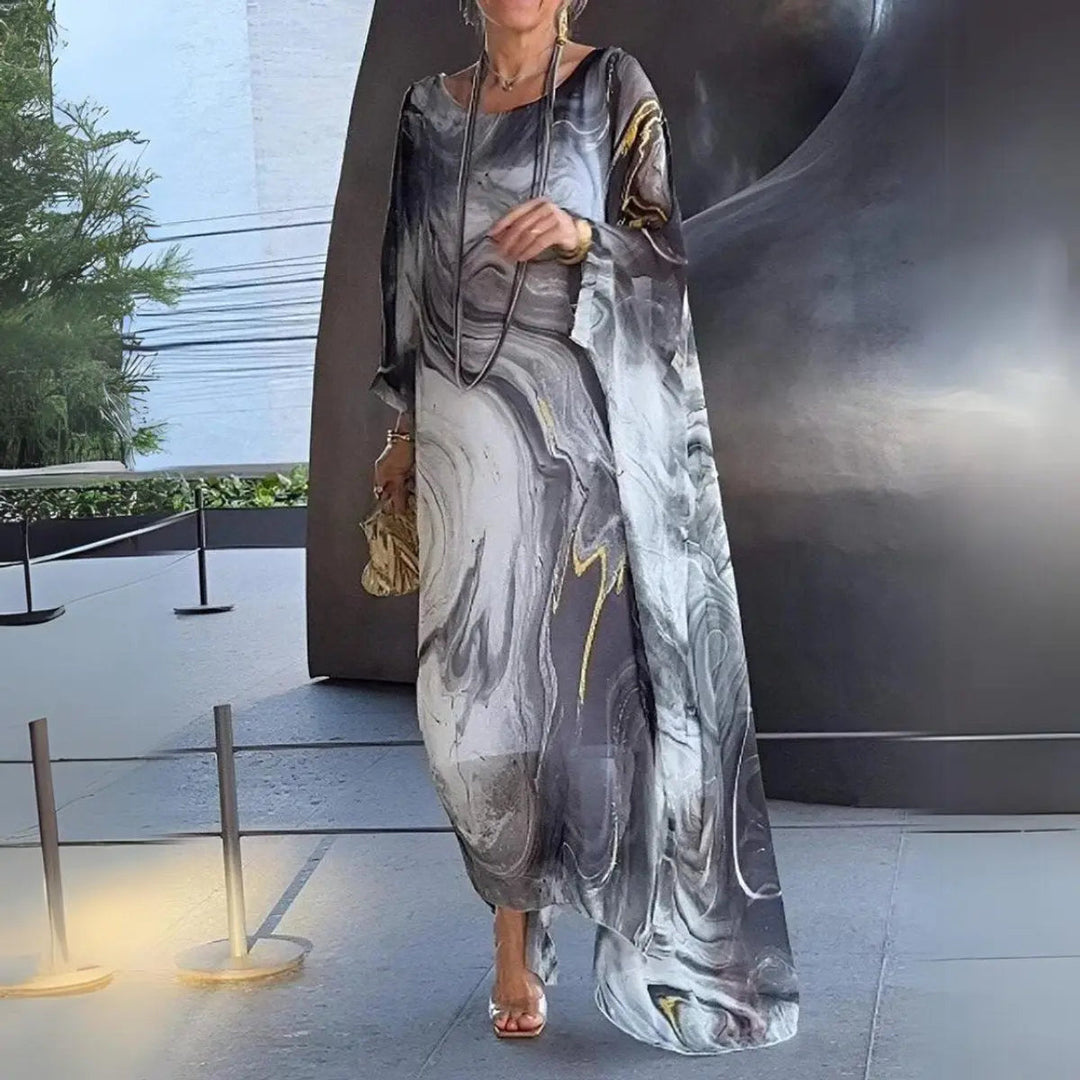 Chic women's floaty batwing maxi dress, perfect for resort wear or stylish day occasions. Long sleeves.