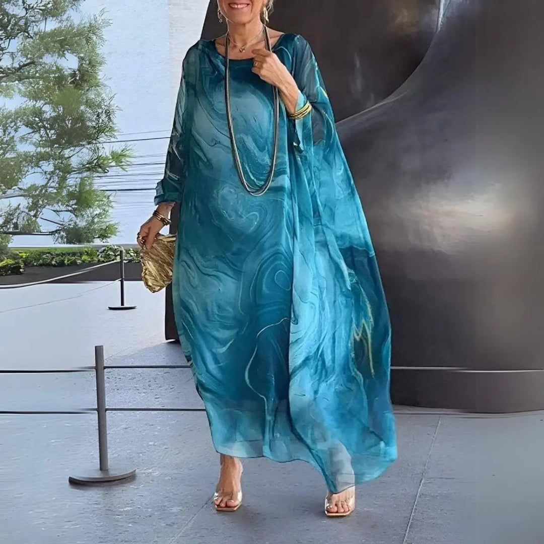 Women's elegant batwing long sleeve maxi dress; a versatile floaty gown for all day and evening events.