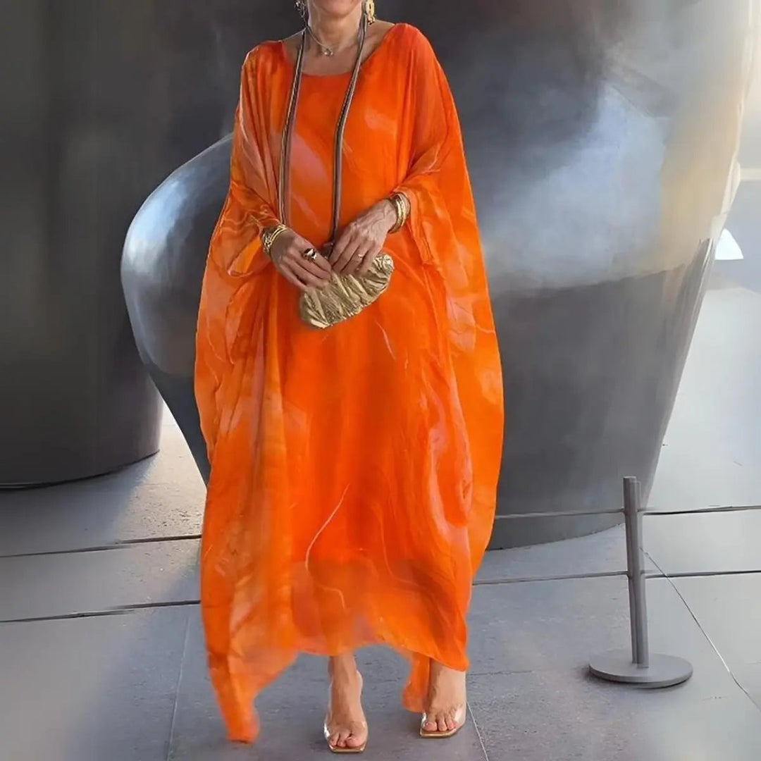 Stylish women's floaty long sleeve maxi dress with elegant batwing design. Perfect for any formal occasion.
