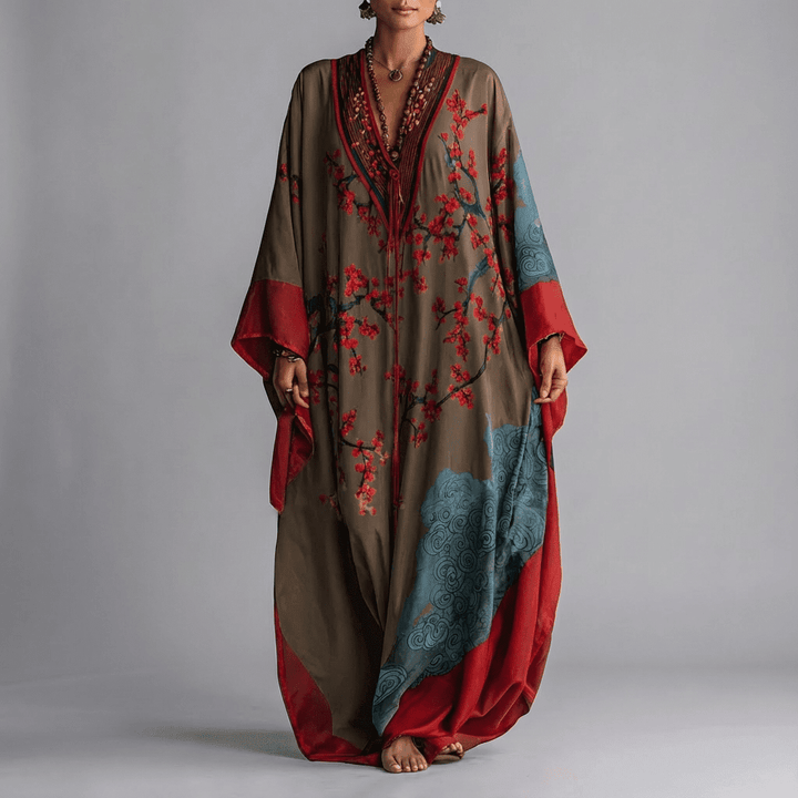 Chic women's batwing sleeve maxi dress in an elegant blossom print, offering a flowing & comfortable fit.