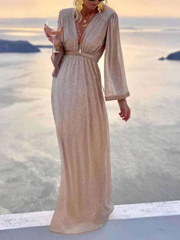 Women's beige shimmer maxi dress with a flattering V-neck and long sleeves, great for formal evening wear.