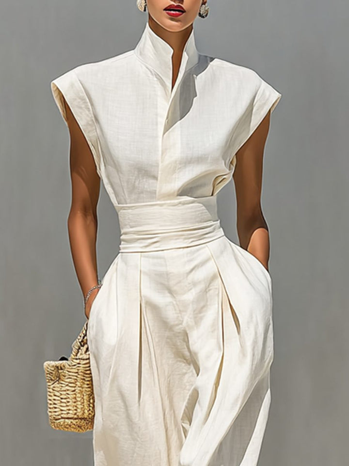 Sophisticated women's occasion dress: beige sleeveless maxi with elegant lapel collar and wrap-style belt.