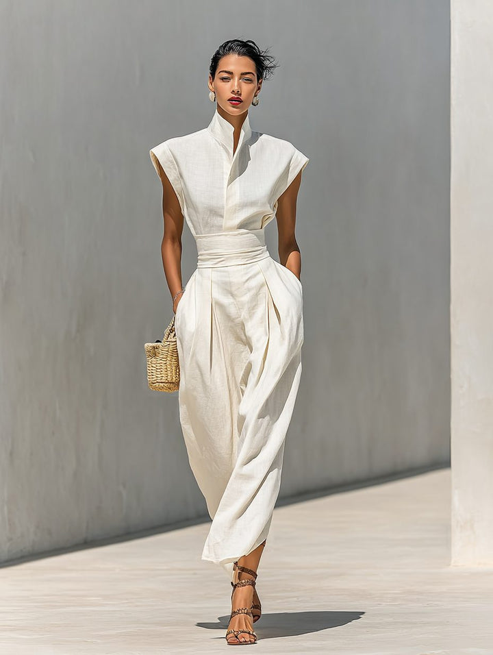 Stylish beige sleeveless wrap maxi dress for women, featuring an elegant lapel and a flattering belted design.