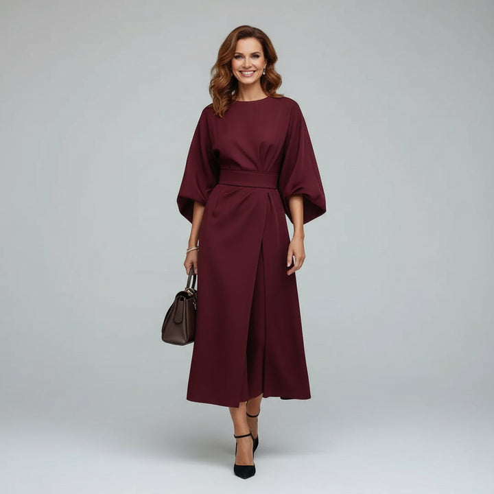 Fashionable women's dress featuring a chic belted detail and midi length