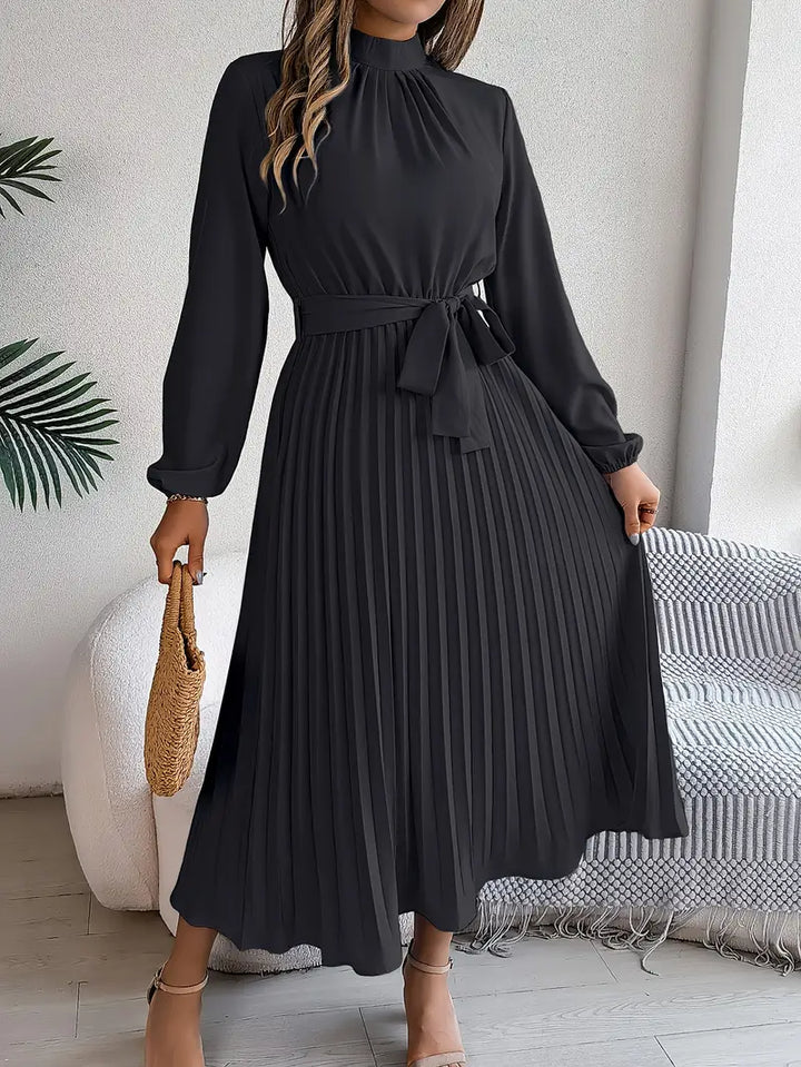 Versatile women's elegant midi dress, belted and pleated with long sleeves, suitable for various events.