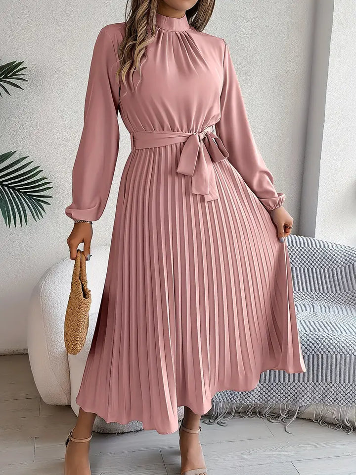 Women's elegant long sleeve pleated midi dress with a stylish belt, ideal for office or party.