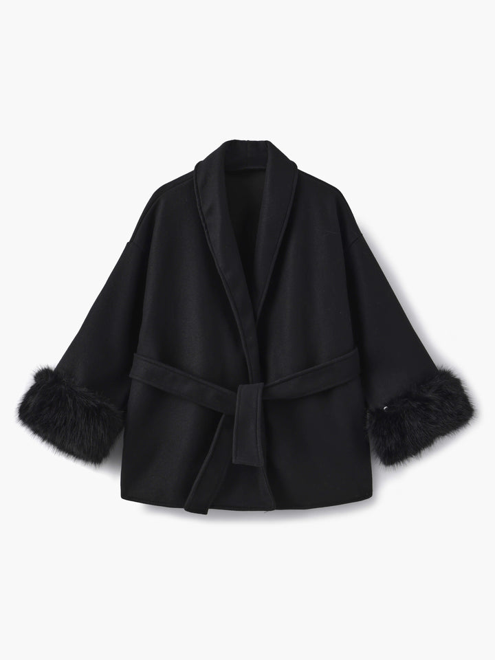 Warm women's winter coat, featuring a wrap front, adjustable belt, and luxurious faux fur cuffs.