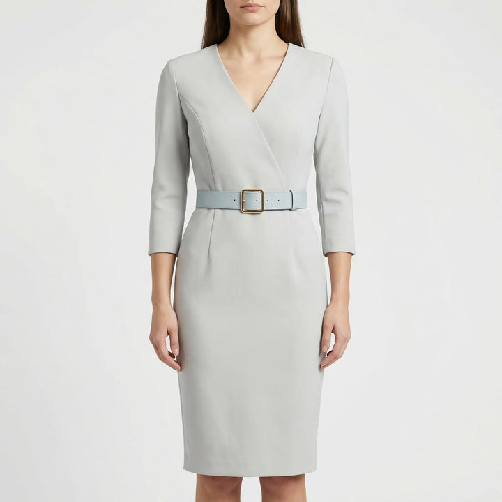 Sophisticated women's belted wrap midi dress. Professional workwear or elegant cocktail look with long sleeves.