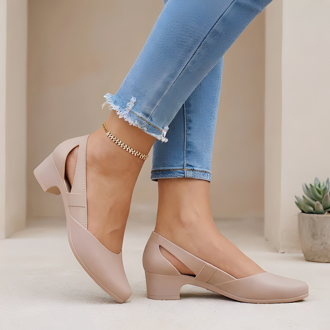 Elegant women's black block heel pumps with pointed toe and chic cutout detail.