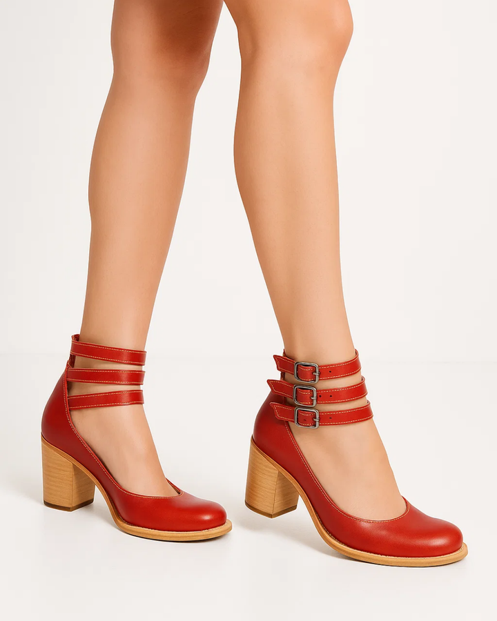 Classic women's block heel pumps with chic ankle straps, offering stability and style for formal occasions.