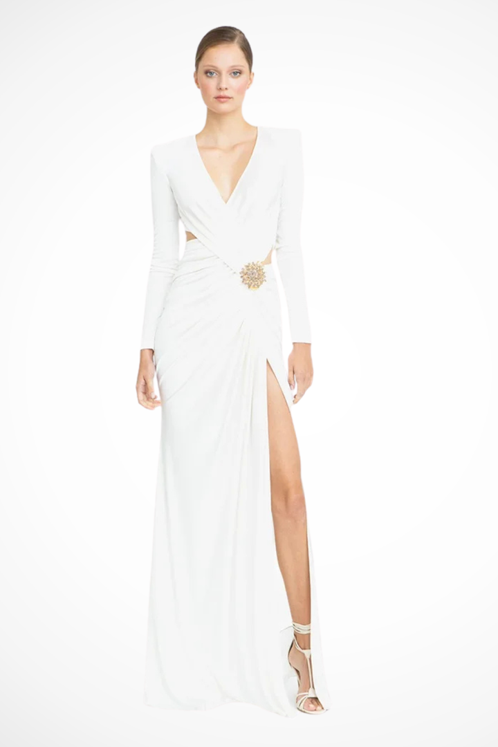 Stylish white long sleeve V-neck ruched maxi dress with side slit for a wedding guest or special occasion.