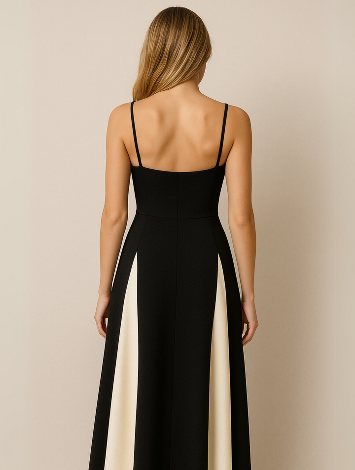 Elegant black maxi dress for women, with a chic contrast panel, offering a flowy and formal evening wear look.