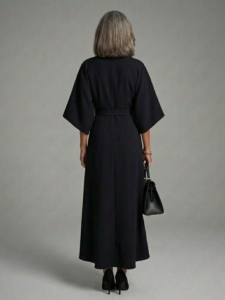 Versatile white midi dress for women, featuring cape sleeves, an asymmetric cut & defined waist. Casual to formal.