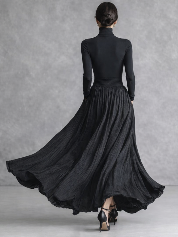 Beautiful women's black pleated turtleneck maxi dress, long sleeve, full skirt, elegant for evening wear.
