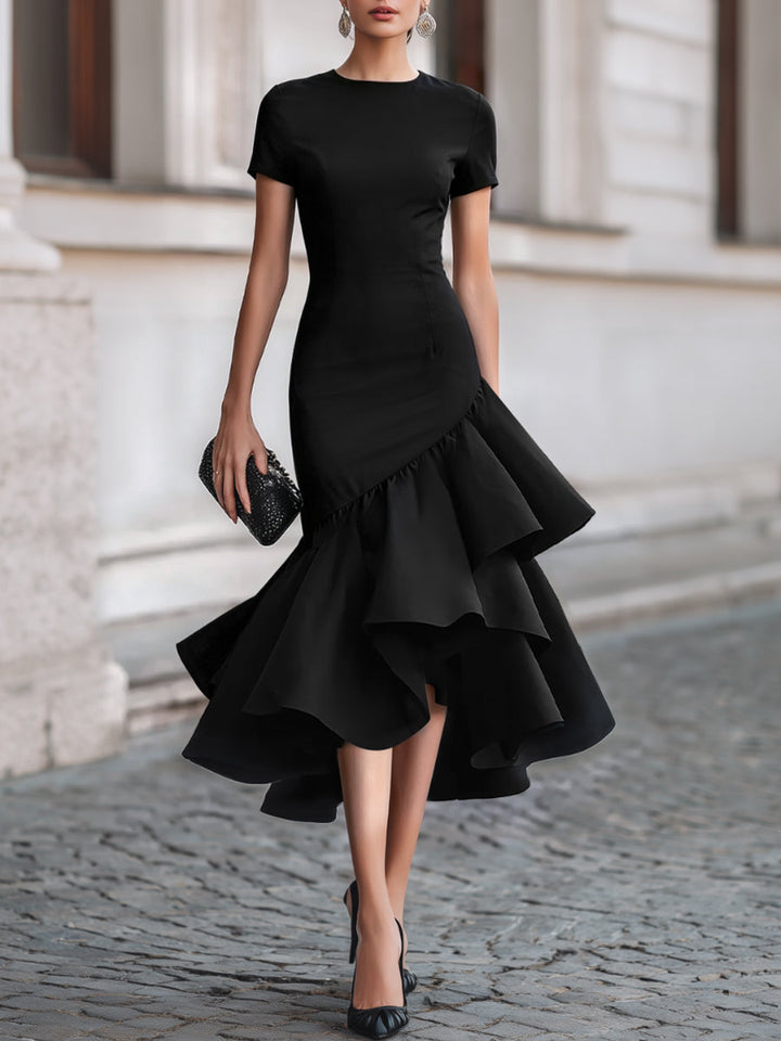 Sophisticated black tailored midi dress with asymmetric hem & ruffle detail; ideal for formal evening occasions.