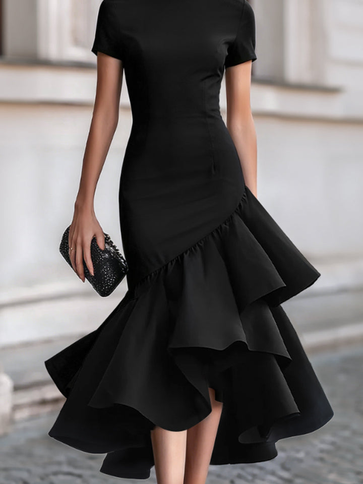 Women's elegant black tailored midi dress featuring a distinctive ruffle and asymmetric hem, for special occasions.