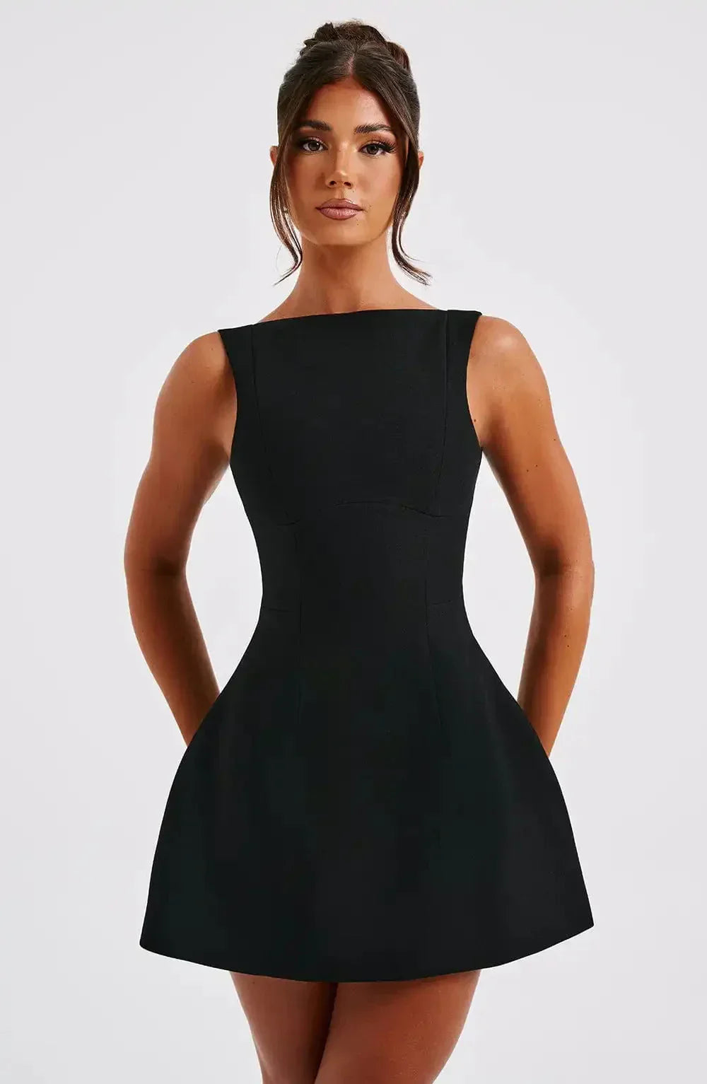 Elegant women's black & white A-line mini dress with boat neck. Sleeveless and versatile, perfect for parties.