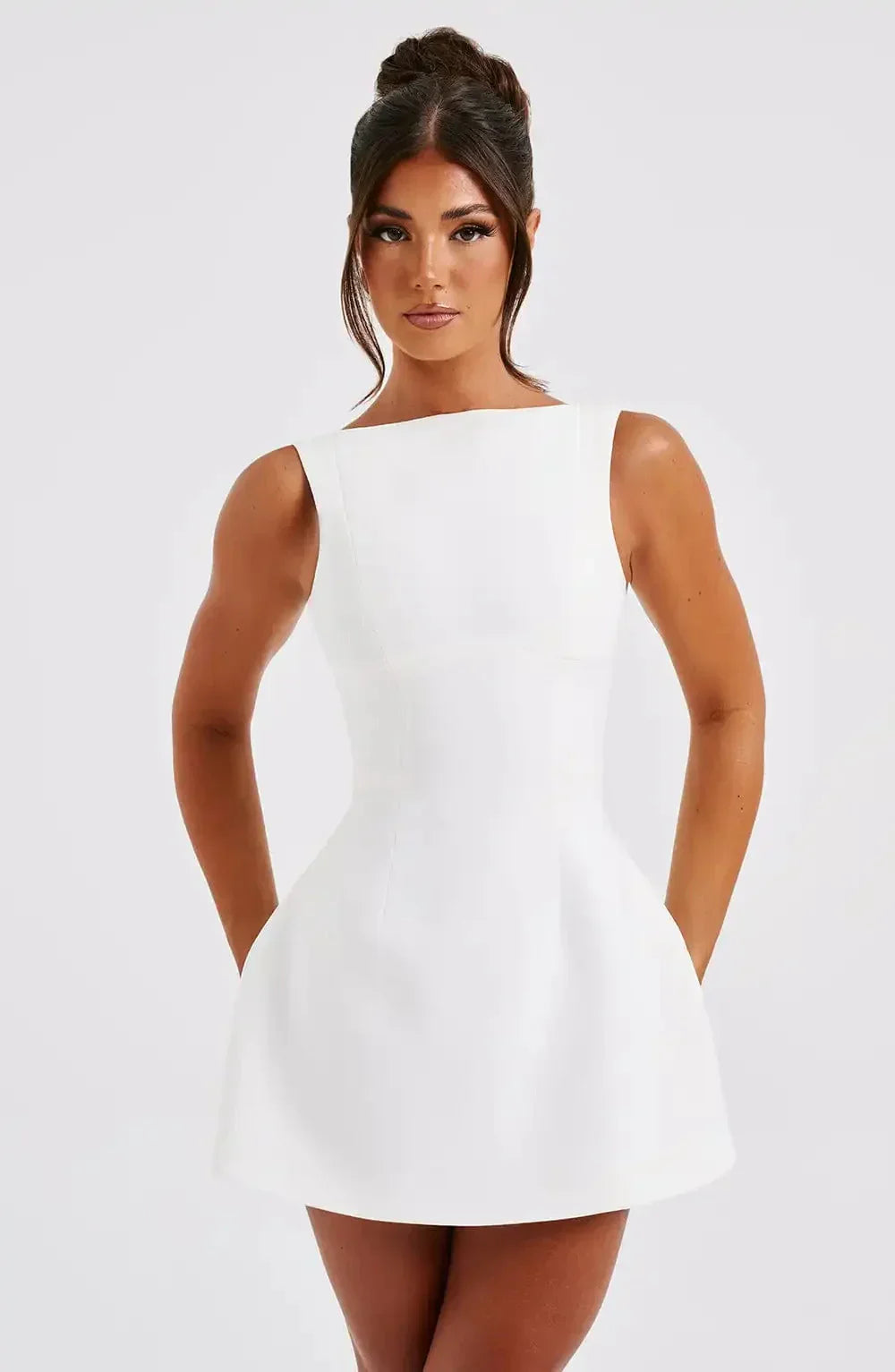 Black & white A-line women's mini dress featuring a boat neck. Elegant sleeveless design for parties.