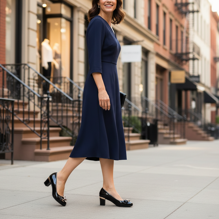 Front view of classic women's elegant block heel pumps, showcasing a delicate bow, for chic day-to-night style.