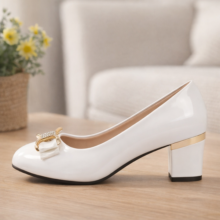 Pair of elegant women's block heel pumps, sleek design with prominent bow detail, comfortable for any occasion.