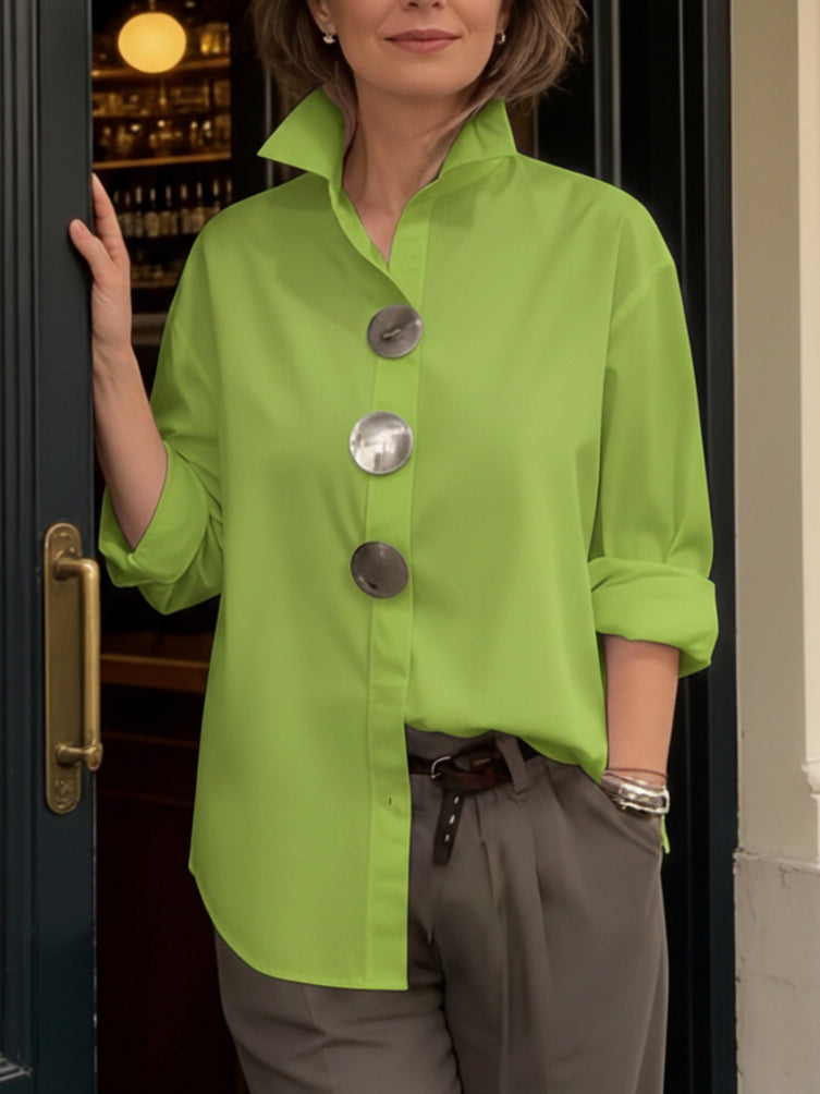 Elegant women's blouse with big button collar, perfect for modern office wear.