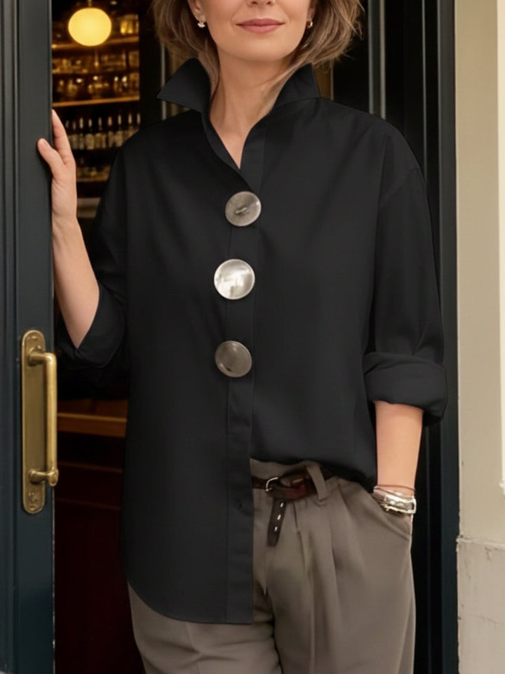 Stylish button-up blouse for women, featuring a unique collar design for an elegant look.